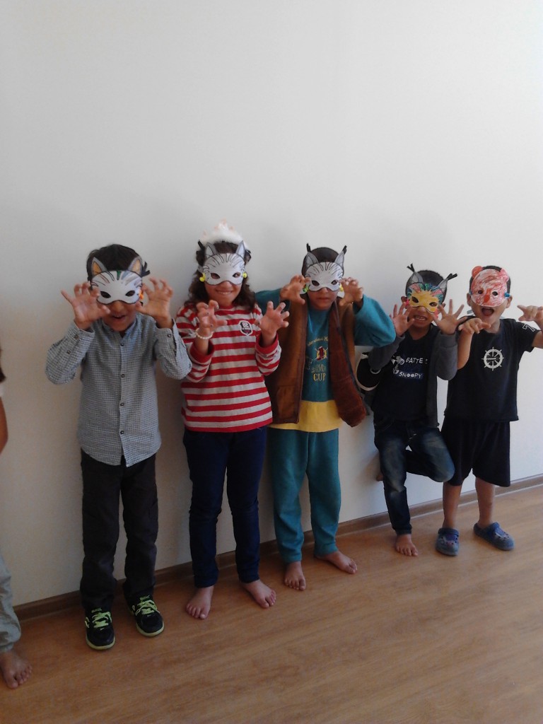 Journey of Halima - Kavala children modeling their masks